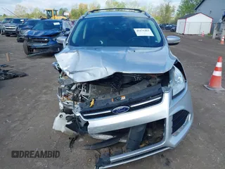 2015 Ford Escape Titanium z VIN 1FMCU9J99FUC75852, wystawiony jako IAAI lot #42171467 z przebiegiem 113 322 mil mil oraz . Historia ofert i sprzedaży dostępna na DreamBid. Obrazek 12.