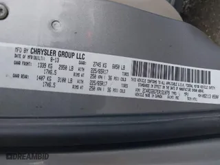 2014 Dodge Grand Caravan SE with VIN 2C4RDGBG7ER131079, listed as a IAAI auction lot 41614495 with 122,925 mi miles. Bid and sale history available at carsss.com. Image 9.