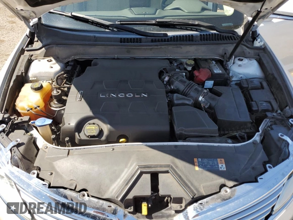 2013 Lincoln MKZ z VIN 3LN6L2GKXDR814615, wystawiony jako Copart lot #65654335 z przebiegiem 100 510 mil mil oraz Szkoda całkowita • Salvage title. Historia ofert i sprzedaży dostępna na DreamBid. Obrazek 11.