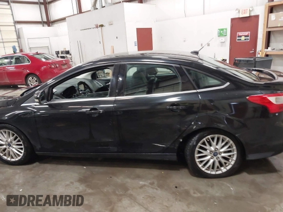 2014 Ford Focus Titanium with VIN 1FADP3J22EL199563, listed as a IAAI auction lot 41450106 with 129,271 mi miles. Bid and sale history available at carsss.com. Image 14.