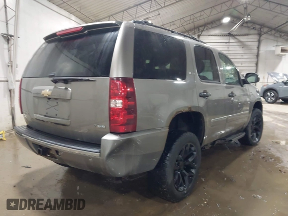 2009 Chevrolet Tahoe LTZ with VIN 1GNFK33049R143390, listed as a IAAI auction lot 41747041 with 209,492 mi miles and . Bid and sale history available at DreamBid. Image 4.