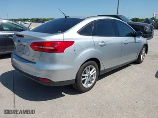 2017 Ford Focus SE with VIN 1FADP3F21HL263170, listed as a IAAI auction lot 41990977 with 104,794 mi miles. Bid and sale history available at carsss.com. Image 4.