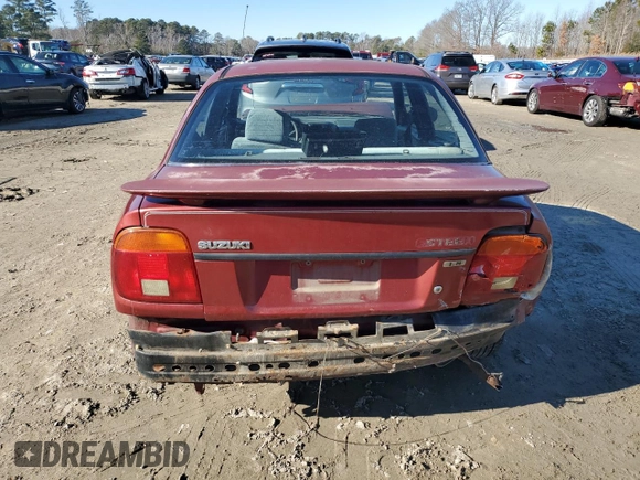 2001 Suzuki Esteem GL z VIN JS2GB41S915202412, wystawiony jako Copart lot #88372235 z przebiegiem 301 061 mil mil oraz Szkoda całkowita • Salvage title. Historia ofert i sprzedaży dostępna na DreamBid. Obrazek 6.