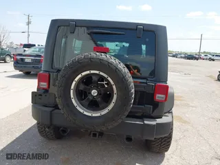 2013 Jeep Wrangler Unlimited Sport with VIN 1C4BJWDG9DL569109, listed as a IAAI auction lot 42115703 with 120,803 mi miles. Bid and sale history available at carsss.com. Image 16.