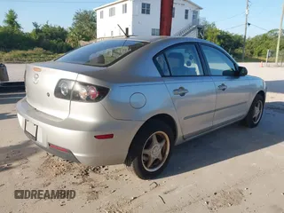 2007 Mazda Mazda3 i Sport with VIN JM1BK12F371721654, listed as a IAAI auction lot 42019268 with 120,518 mi miles. Bid and sale history available at carsss.com. Image 4.