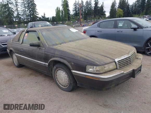 1992 Cadillac Eldorado z VIN 1G6EL13B0NU605624, wystawiony jako IAAI lot #42127549 z przebiegiem Nie podano mil oraz . Historia ofert i sprzedaży dostępna na DreamBid. Obrazek 1.
