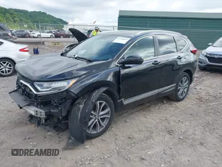 2021 Honda CR-V Touring with VIN 5J6RW2H92ML003064, listed as a IAAI auction lot 42298361 with 70,988 mi miles and . Bid and sale history available at DreamBid. Image 2.