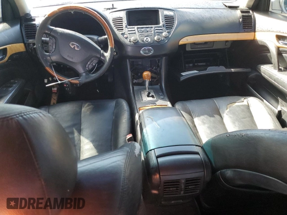 2003 Infiniti Q45 z VIN JNKBF01AX3M103002, wystawiony jako Copart lot #47860175 z przebiegiem 317 912 mil mil oraz Tytuł czysty. Historia ofert i sprzedaży dostępna na DreamBid. Obrazek 8.