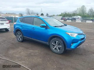 2017 Toyota RAV4 XLE with VIN JTMRFREV4HJ123496, listed as a IAAI auction lot 42068817 with 211,682 mi miles. Bid and sale history available at carsss.com. Image 1.