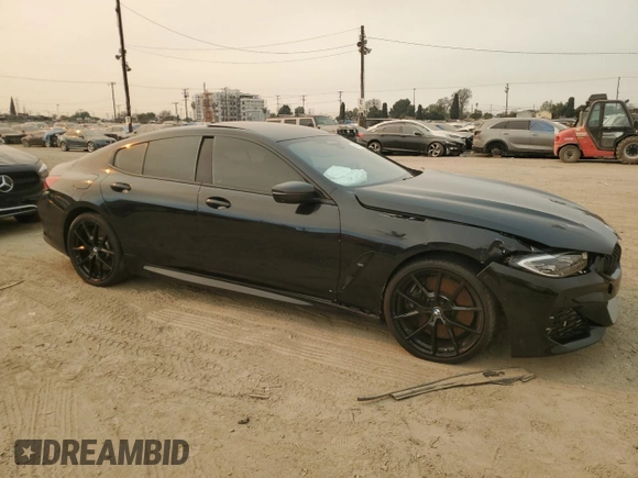 2022 BMW 8 Series M850i with VIN WBAGV8C02NCK08667, listed as a Copart auction lot 88255605 with 22,737 mi miles and Salvage title. Bid and sale history available at DreamBid. Image 4.