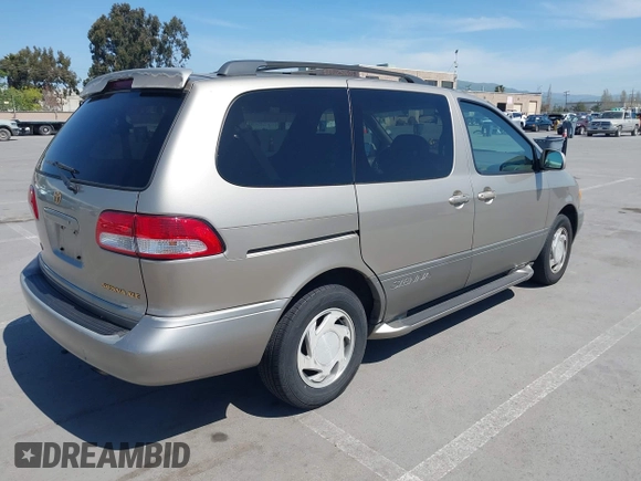 2001 Toyota Sienna LE with VIN 4T3ZF13C21U397063, listed as a IAAI auction lot 42033574 with 219,783 mi miles. Bid and sale history available at carsss.com. Image 4.