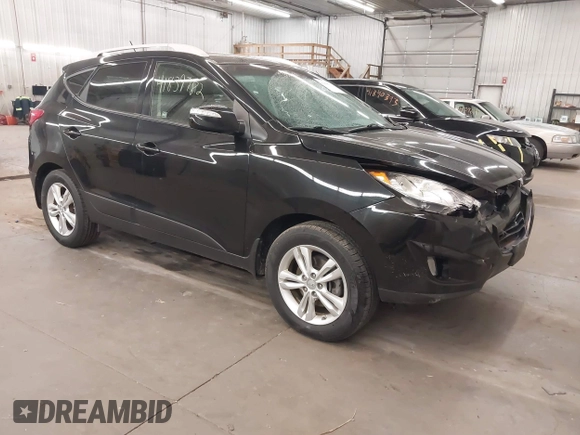 2013 Hyundai Tucson GLS with VIN KM8JU3AC8DU557445, listed as a IAAI auction lot 41839782 with 153,769 mi miles. Bid and sale history available at carsss.com. Image 1.