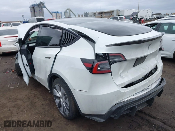 2023 Tesla Model Y Long Range with VIN 7SAYGDEE0PA112870, listed as a IAAI auction lot 41727017 with 24,246 mi miles. Bid and sale history available at carsss.com. Image 3.