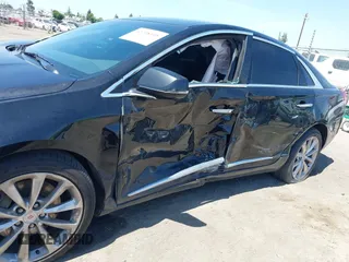 2013 Cadillac XTS Luxury z VIN 2G61R5S32D9226506, wystawiony jako IAAI lot #42208105 z przebiegiem 140 255 mil mil oraz . Historia ofert i sprzedaży dostępna na DreamBid. Obrazek 6.
