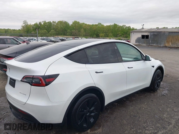 2024 Tesla Model Y Long Range with VIN 7SAYGAEE2RF014315, listed as a IAAI auction lot 42053183 with 36,521 mi miles and . Bid and sale history available at DreamBid. Image 4.
