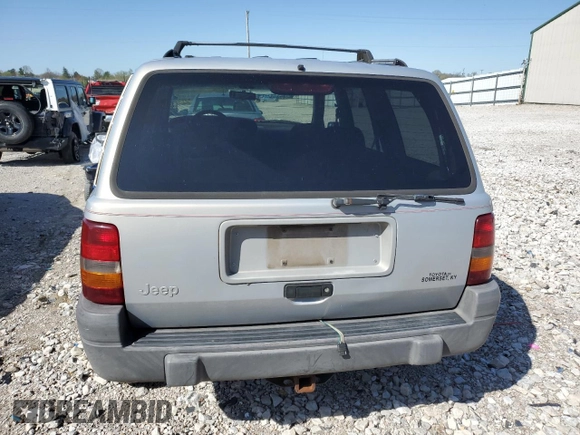 1997 Jeep Grand Cherokee Laredo with VIN 1J4GZ58S5VC561060, listed as a Copart auction lot 52098315 with 267,245 mi miles and Salvage title. Bid and sale history available at DreamBid. Image 6.