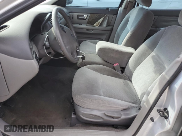 2003 Ford Taurus LX Standard z VIN 1FAFP52U43A110444, wystawiony jako Copart lot #83557764 z przebiegiem 118 897 mil mil oraz Szkoda całkowita • Salvage title. Historia ofert i sprzedaży dostępna na DreamBid. Obrazek 7.
