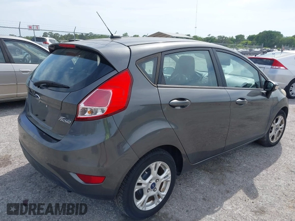 2016 Ford Fiesta SE with VIN 3FADP4EJ4GM129006, listed as a IAAI auction lot 42085892 with 146,044 mi miles. Bid and sale history available at carsss.com. Image 4.