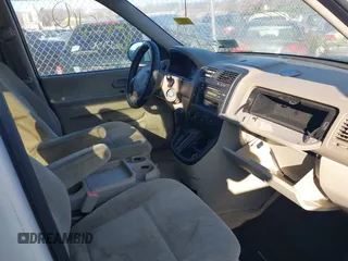 2005 Kia Sedona LX with VIN KNDUP132756764528, listed as a IAAI auction lot 41709414 with 999,999 mi miles. Bid and sale history available at carsss.com. Image 5.