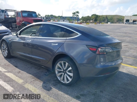 2020 Tesla Model 3 Standard Range Plus with VIN 5YJ3E1EA0LF744046, listed as a IAAI auction lot 41939894 with 102,576 mi miles. Bid and sale history available at carsss.com. Image 3.