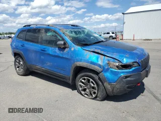 2021 Jeep Cherokee Trailhawk with VIN 1C4PJMBXXMD110436, listed as a Copart auction lot 57829375 with 46,647 mi miles and Salvage title. Bid and sale history available at DreamBid. Image 4.