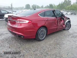 2018 Ford Fusion Titanium with VIN 3FA6P0D91JR233679, listed as a IAAI auction lot 42182140 with 100,706 mi miles and . Bid and sale history available at DreamBid. Image 4.
