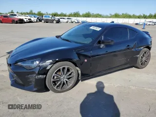 2017 Toyota 86 z VIN JF1ZNAA18H9702828, wystawiony jako Copart lot #58639625 z przebiegiem 89 026 mil mil oraz Szkoda całkowita • Salvage title. Historia ofert i sprzedaży dostępna na DreamBid. Obrazek 1.