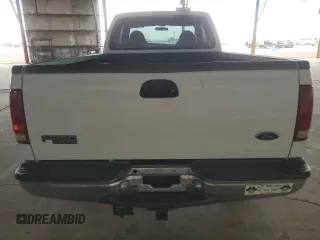 2000 Ford Super Duty F-250 XL with VIN 1FTNX21S9YED03242, listed as a Copart auction lot 74542704 with 218,739 mi miles and Salvage Title. Bid and sale history available at carsss.com. Image 6.