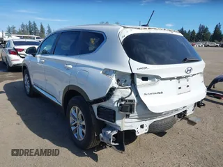 2019 Hyundai Santa Fe SE with VIN 5NMS2CAD0KH098259, listed as a IAAI auction lot 42075356 with 55,163 mi miles and . Bid and sale history available at DreamBid. Image 3.