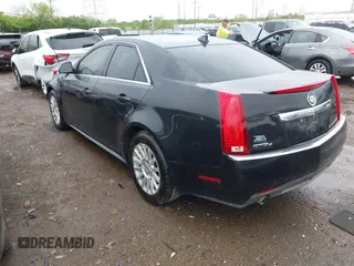 2013 Cadillac CTS Luxury z VIN 1G6DG5E52D0111849, wystawiony jako IAAI lot #42130235 z przebiegiem 129 993 mil mil oraz . Historia ofert i sprzedaży dostępna na DreamBid. Obrazek 3.