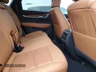 2022 Cadillac XT5 FWD Premium Luxury z VIN 1GYKNCRS1NZ126722, wystawiony jako Copart lot #87977755 z przebiegiem Nie podano mil oraz Nie do naprawy • Non repairable. Historia ofert i sprzedaży dostępna na DreamBid. Obrazek 11.