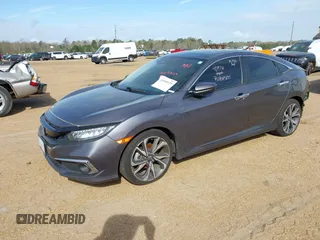 2020 Honda Civic Sedan Touring with VIN 19XFC1F97LE001901, listed as a IAAI auction lot 41048129 with 67,027 mi miles. Bid and sale history available at carsss.com. Image 2.