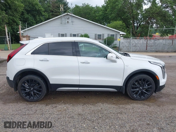 2022 Cadillac XT4 AWD Premium Luxury z VIN 1GYFZDR42NF128199, wystawiony jako IAAI lot #42522314 z przebiegiem 29 002 mil mil oraz . Historia ofert i sprzedaży dostępna na DreamBid. Obrazek 13.
