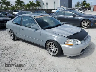 1997 Honda Civic EX z VIN 1HGEJ8143VL043998, wystawiony jako Copart lot #51795345 z przebiegiem 129 631 mil mil oraz Nie do naprawy • Non repairable. Historia ofert i sprzedaży dostępna na DreamBid. Obrazek 4.