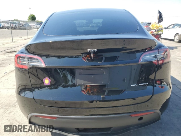 2023 Tesla Model Y Long Range z VIN 7SAYGAEE7PF859030, wystawiony jako Copart lot #58965185 z przebiegiem 18 421 mil mil oraz Czysty tytuł • Clean title. Historia ofert i sprzedaży dostępna na DreamBid. Obrazek 6.