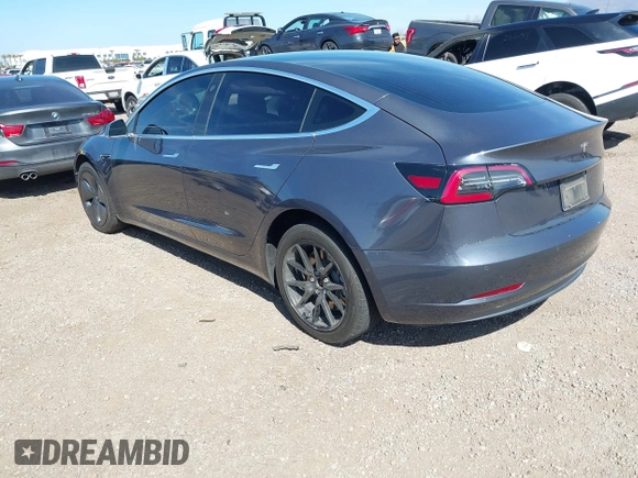 2020 Tesla Model 3 Standard Range Plus with VIN 5YJ3E1EA5LF644282, listed as a IAAI auction lot 41710124 with 69,969 mi miles and . Bid and sale history available at DreamBid. Image 3.