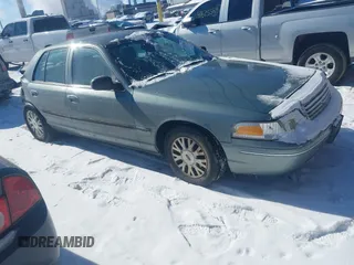 2005 Ford Crown Victoria LX z VIN 2FAFP74W85X131494, wystawiony jako IAAI lot #41620849 z przebiegiem 127 245 mil mil oraz . Historia ofert i sprzedaży dostępna na DreamBid. Obrazek 1.