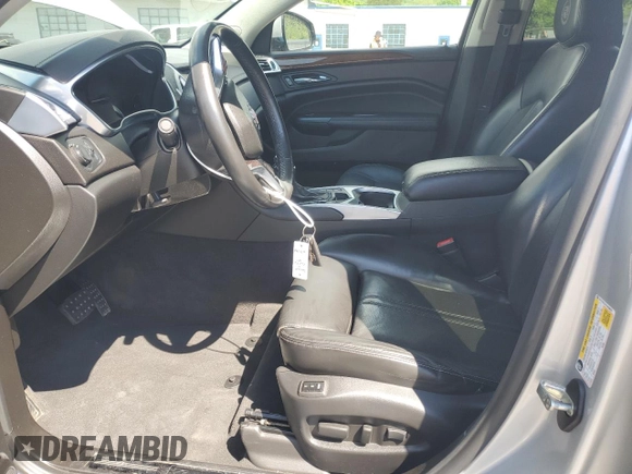 2014 Cadillac SRX Luxury Collection z VIN 3GYFNEE37ES630832, wystawiony jako Copart lot #56335035 z przebiegiem 102 076 mil mil oraz Szkody całkowita. Historia ofert i sprzedaży dostępna na DreamBid. Obrazek 7.