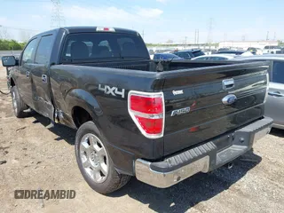 2014 Ford F-150 XL with VIN 1FTFW1ETXEFB51711, listed as a IAAI auction lot 42075381 with 238,603 mi miles. Bid and sale history available at carsss.com. Image 3.
