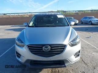 2016 Mazda CX-5 Grand Touring z VIN JM3KE2DY8G0709573, wystawiony jako IAAI lot #42021005 z przebiegiem 113 941 mil mil oraz . Historia ofert i sprzedaży dostępna na DreamBid. Obrazek 13.