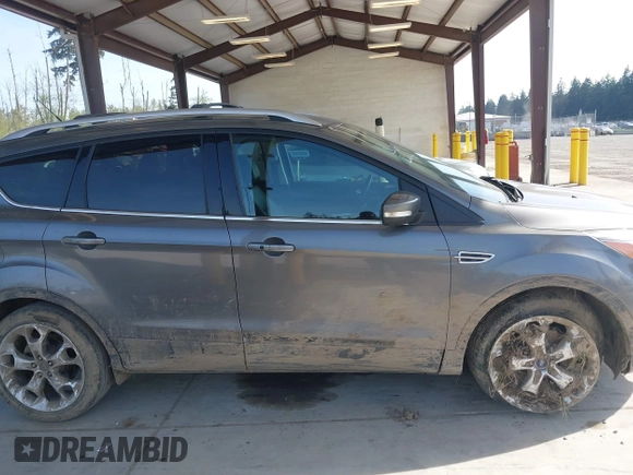 2014 Ford Escape Titanium with VIN 1FMCU9JX0EUC45801, listed as a IAAI auction lot 42121561 with 80,217 mi miles and . Bid and sale history available at DreamBid. Image 13.