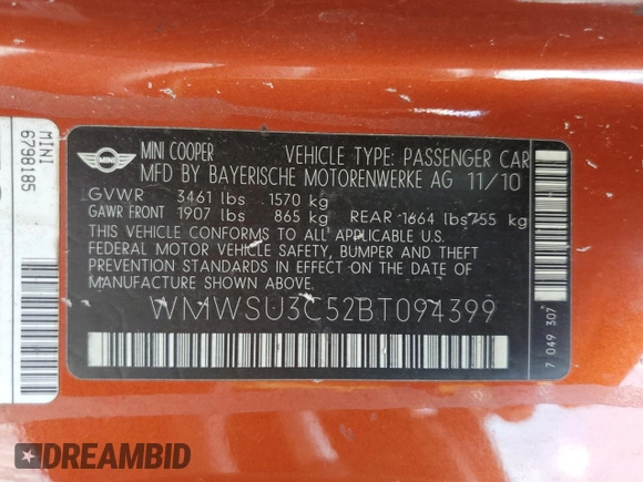 2011 MINI Hardtop with VIN WMWSU3C52BT094399, listed as a Copart auction lot 56561635 with 94,428 mi miles and Salvage Title. Bid and sale history available at DreamBid. Image 12.
