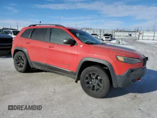 2019 Jeep Cherokee Trailhawk with VIN 1C4PJMBX7KD361816, listed as a Copart auction lot 46457465 with 244,301 mi miles and Salvage Title. Bid and sale history available at DreamBid. Image 4.