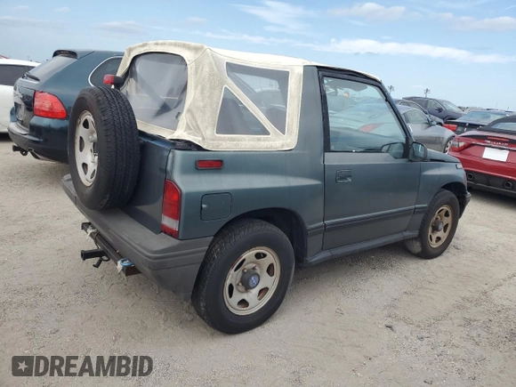 1994 Geo Tracker z VIN 2CNBE18U1R6918878, wystawiony jako Copart lot #75894834 z przebiegiem Nie podano mil oraz Nie do naprawy. Historia ofert i sprzedaży dostępna na DreamBid. Obrazek 3.