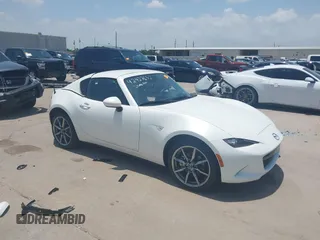 2021 Mazda MX-5 Miata Grand Touring with VIN JM1NDAM71M0457011, listed as a IAAI auction lot 42427652 with 4,045 mi miles and . Bid and sale history available at DreamBid. Image 1.
