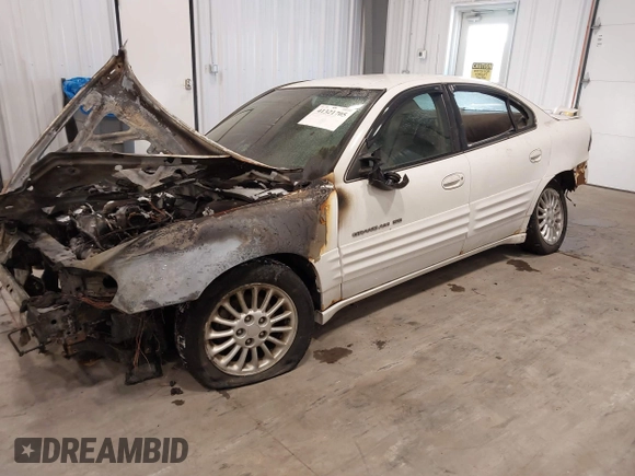 1999 Pontiac Grand Am SE2 with VIN 1G2NE52E4XM864232, listed as a IAAI auction lot 41321705 with 1 mi miles. Bid and sale history available at carsss.com. Image 2.