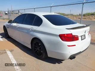 2013 BMW 5 Series 528i with VIN WBAXG5C56DD230121, listed as a IAAI auction lot 42019899 with 142,100 mi miles and . Bid and sale history available at carsss.com. Image 3.