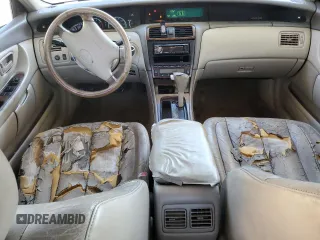 2000 Toyota Avalon XL z VIN 4T1BF28B2YU079163, wystawiony jako Copart lot #50129935 z przebiegiem 311 916 mil mil oraz Nie do naprawy • Non repairable. Historia ofert i sprzedaży dostępna na DreamBid. Obrazek 8.