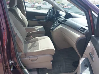 2013 Honda Odyssey LX with VIN 5FNRL5H28DB058401, listed as a IAAI auction lot 42050892 with 221,016 mi miles and . Bid and sale history available at carsss.com. Image 5.