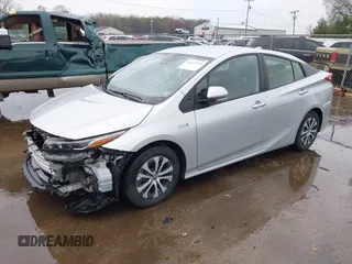 2021 Toyota Prius LE with VIN JTDKAMFP9M3170928, listed as a IAAI auction lot 42123934 with 58,293 mi miles and . Bid and sale history available at DreamBid. Image 2.